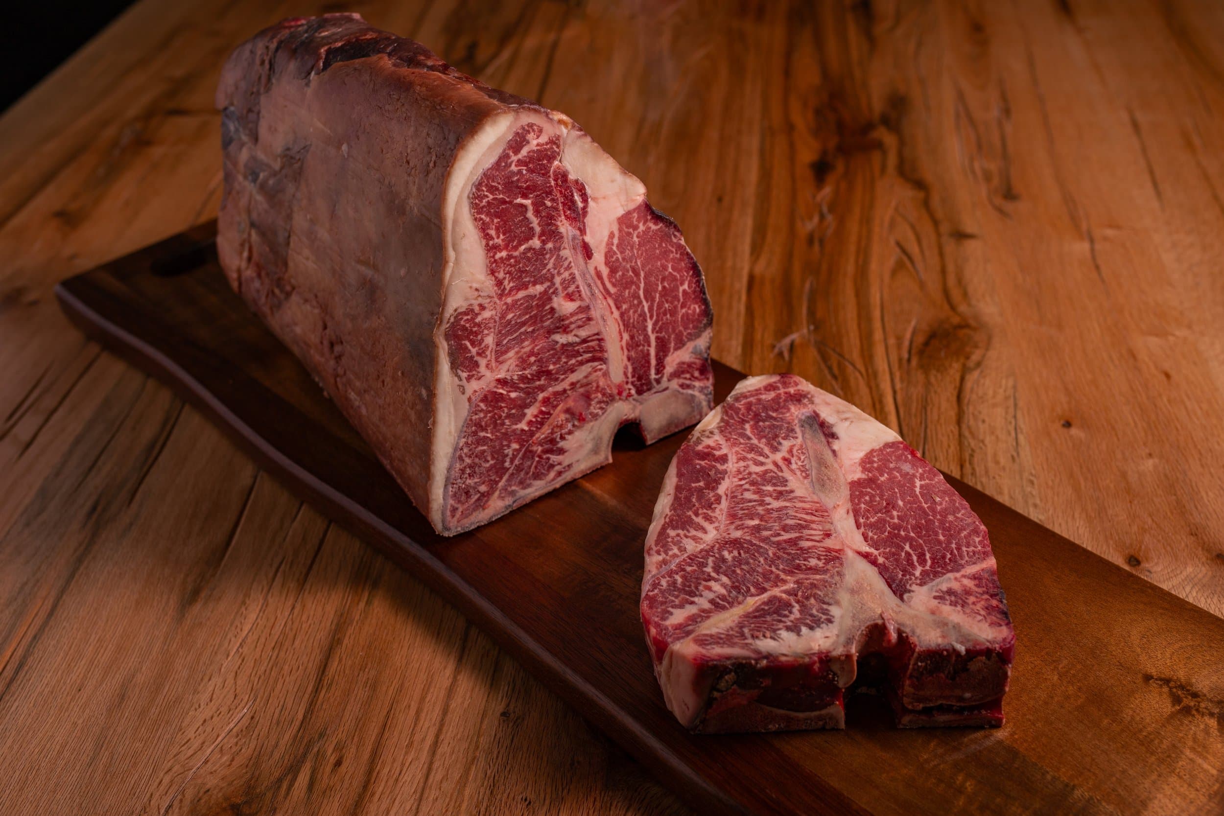 Clines Custom Meats Porterhouse Steak on Cutting Board 4.jpg