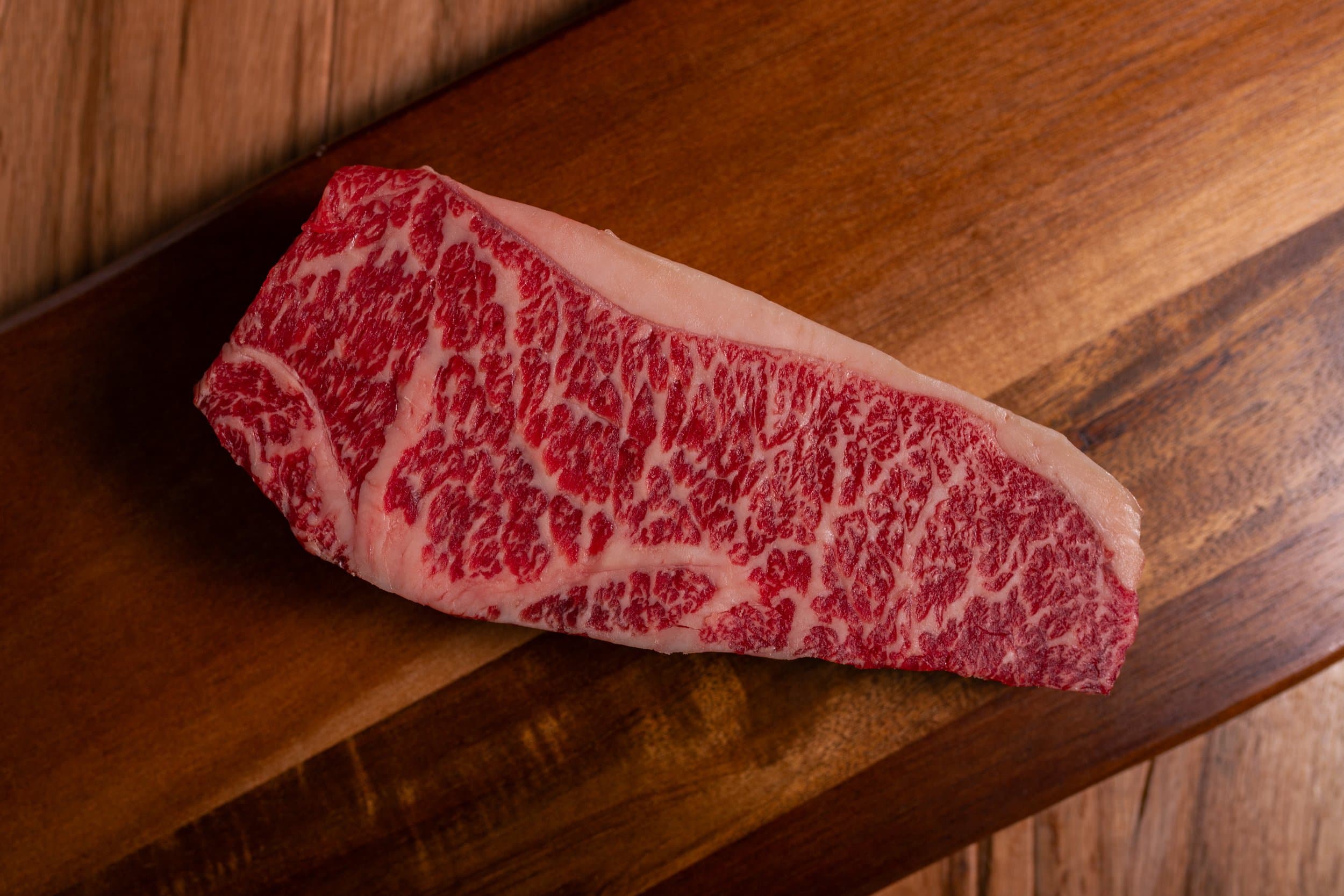 Clines Custom Meats Wagyu Steak on Cutting Board 2.jpg